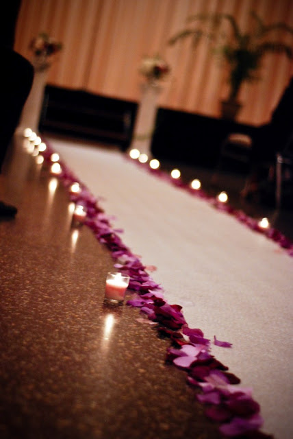 wedding aisle with petals and candles