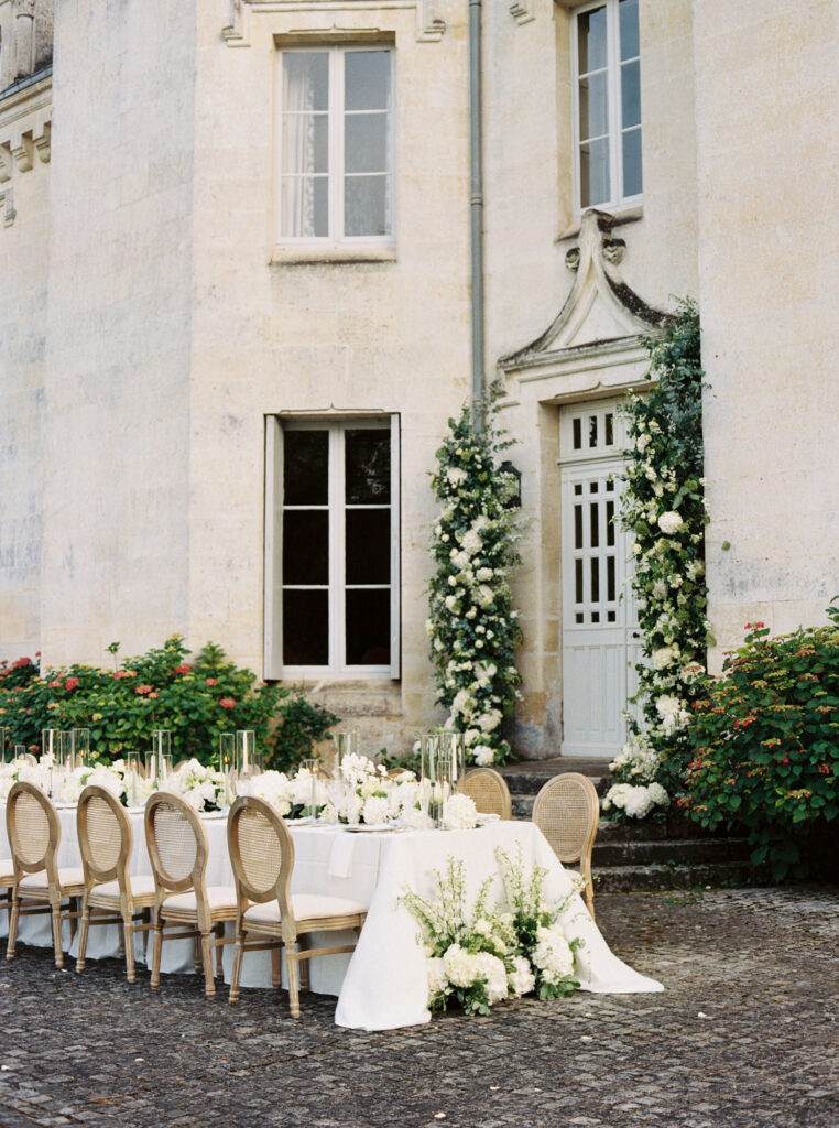 Outdoor wedding table setup in front Château Le Petit Verdus