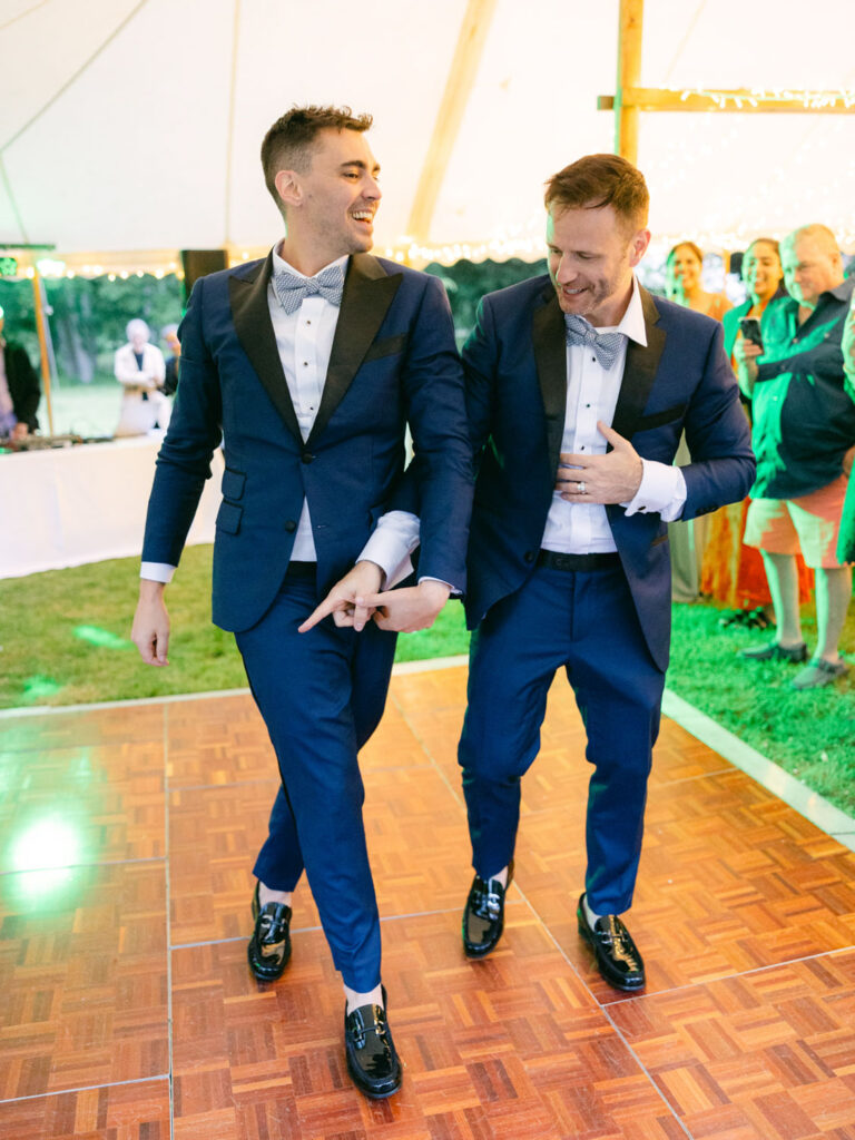 Kevin and Steven share a joyful moment on the dance floor at their wedding in France