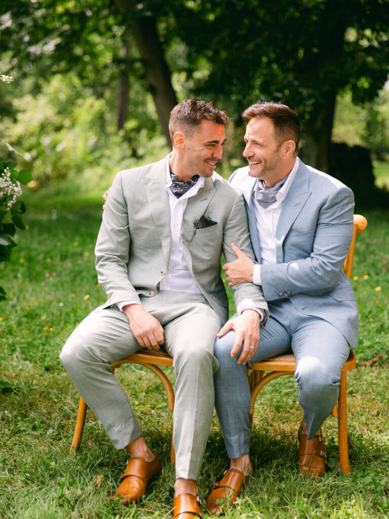 Kevin and Steven sharing a heartfelt moment during their wedding in a beautiful French garden