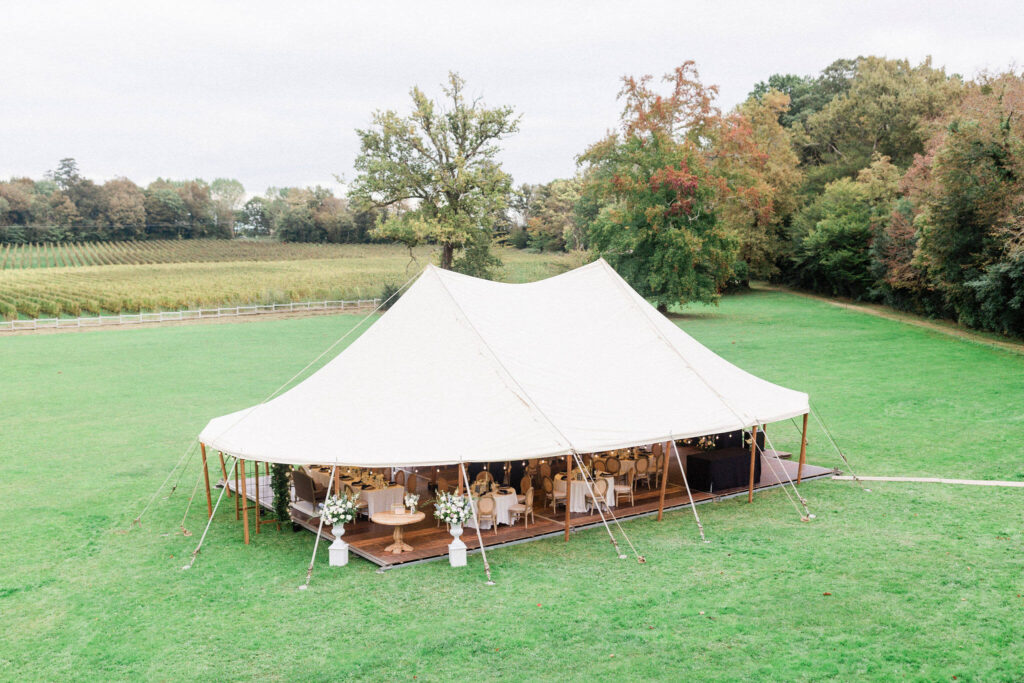 Outdoor tent prepared for a rainy wedding day celebration