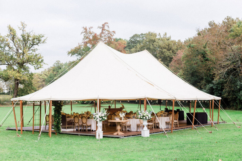 Outdoor tent setup elegantly decorated for a rainy day wedding