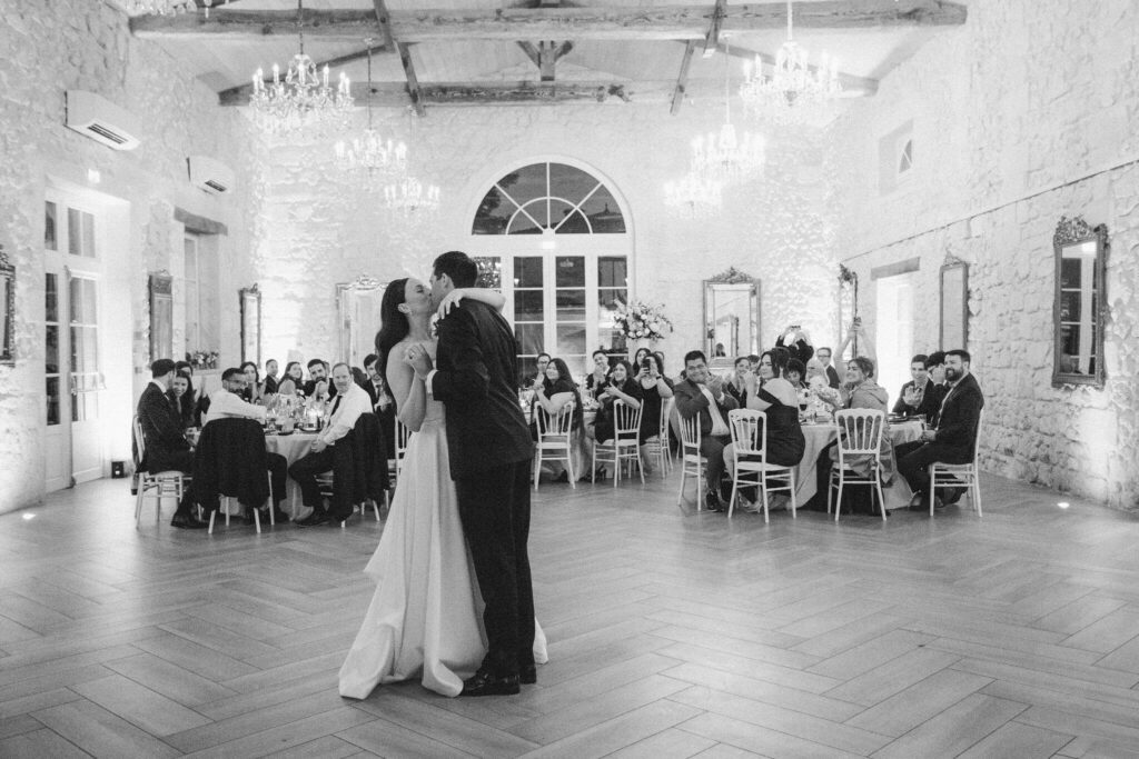 Bride and groom kissing on their first dance