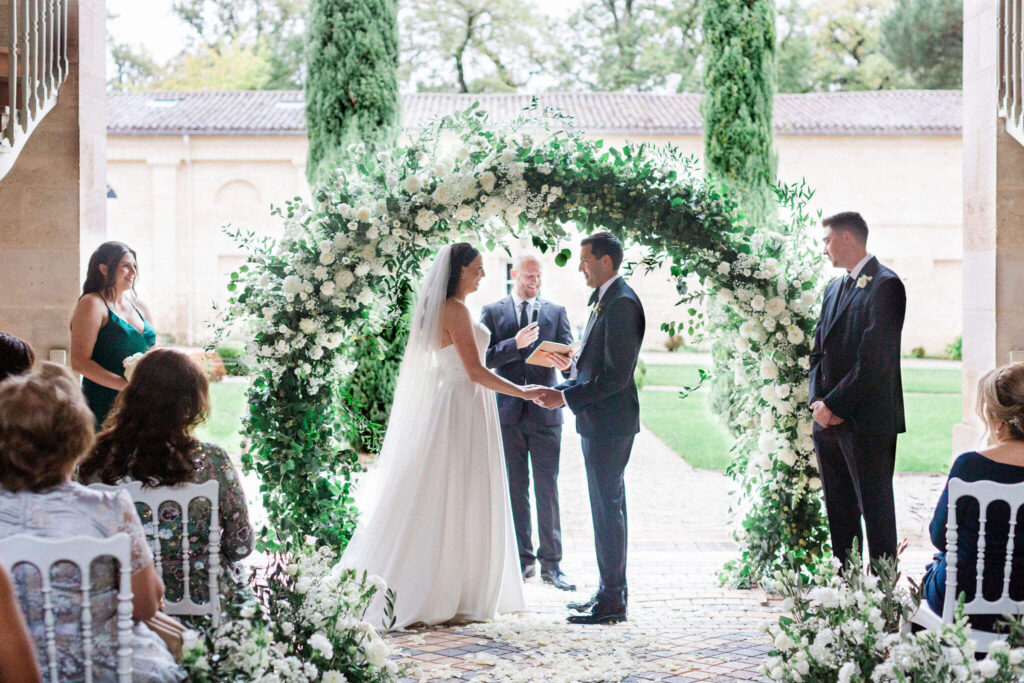 Bride and groom exchanging vows during their wedding ceremony