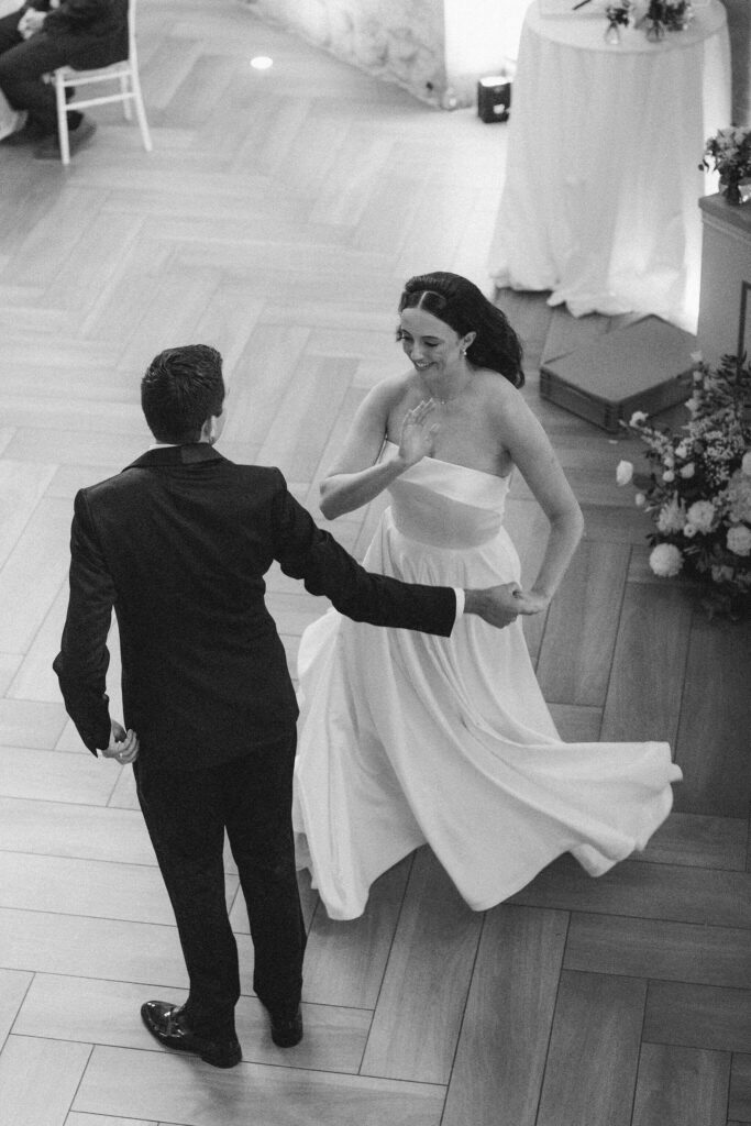 Bride and groom happily dancing