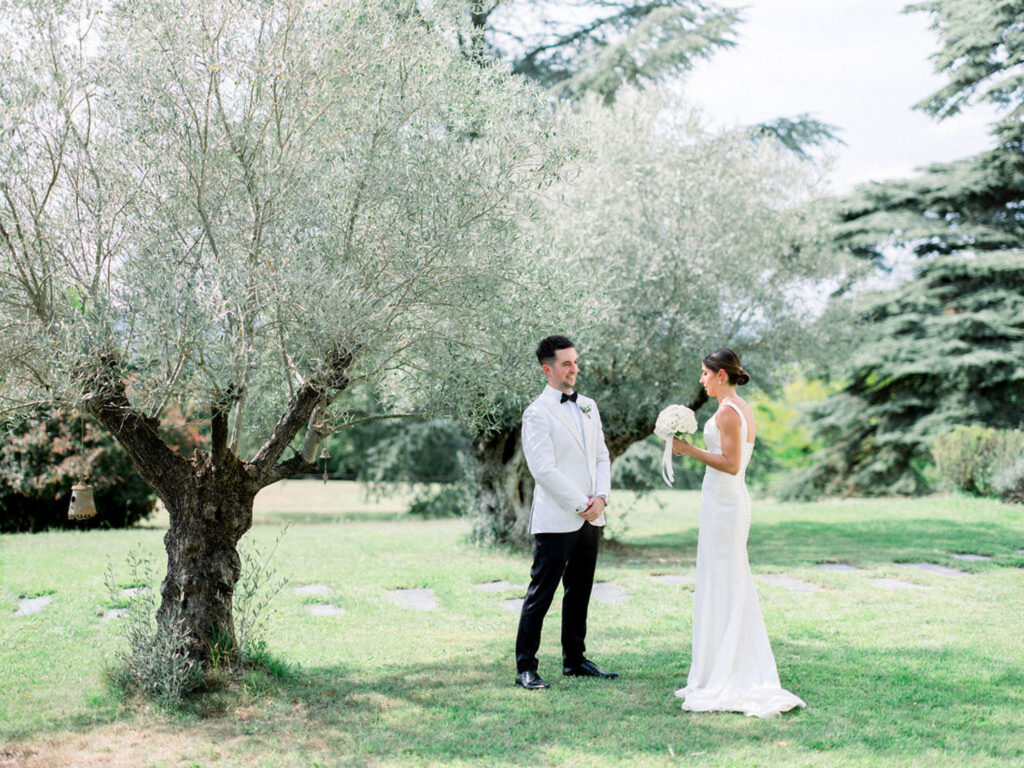 Alexandra and Thomas sharing a moment under a tree