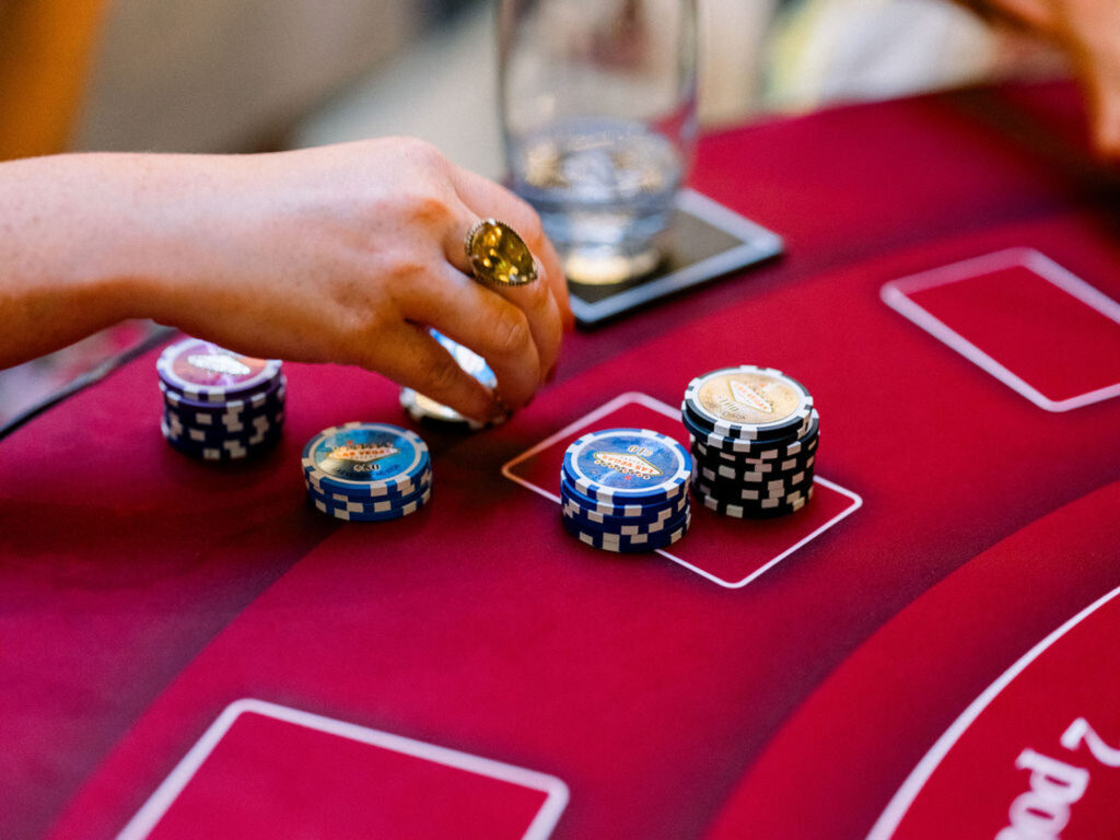 Close-up of poker chips during the casino-themed reception