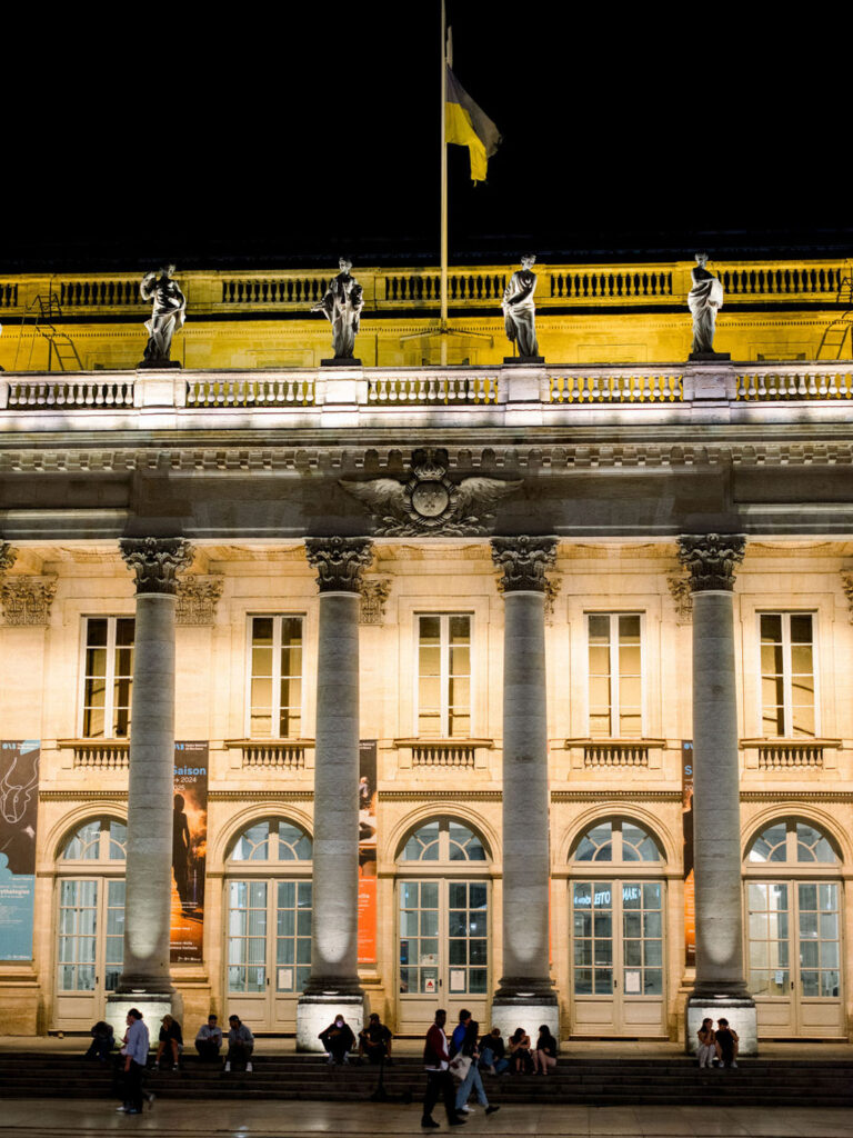 Exterior view of a beautifully lit building at night during the reception