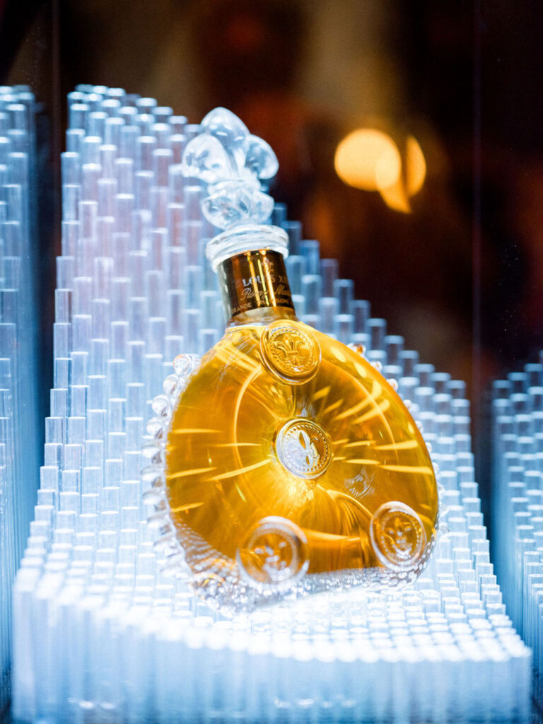 Close-up of a luxury decanter illuminated in a decorative display