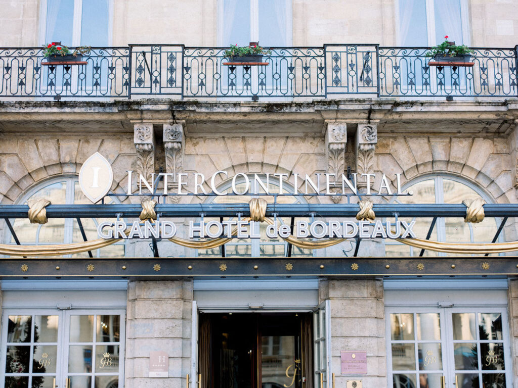 Grand entrance of InterContinental Grand Hotel de Bordeaux with ornate architecture