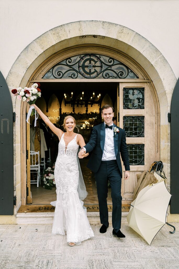 Bride and groom holding each other's hands