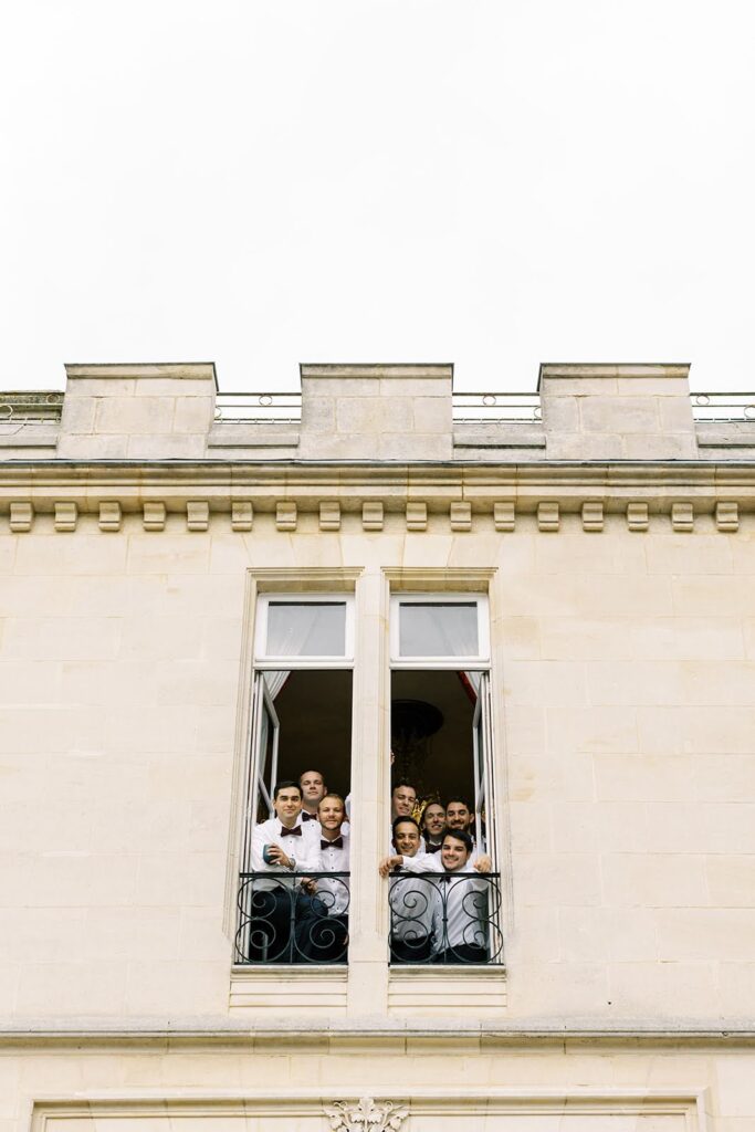 Wedding guests viewed from a balcony