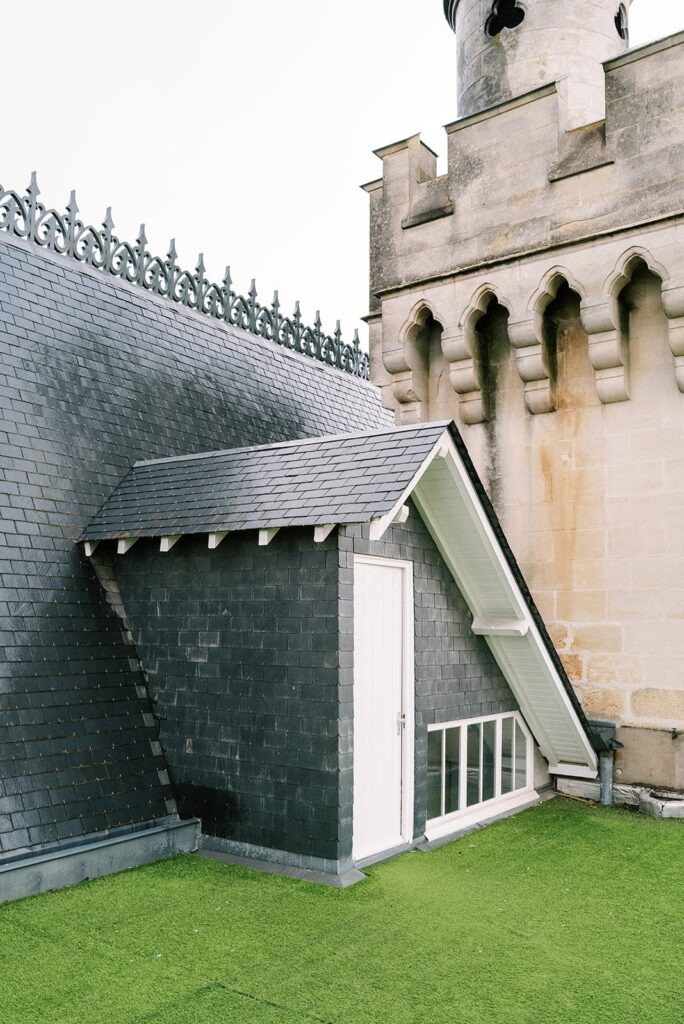 Close-up of a wedding venue's roof detail on a rainy day