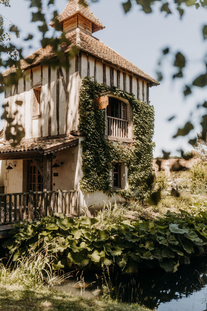 Charming French villa surrounded by greenery.