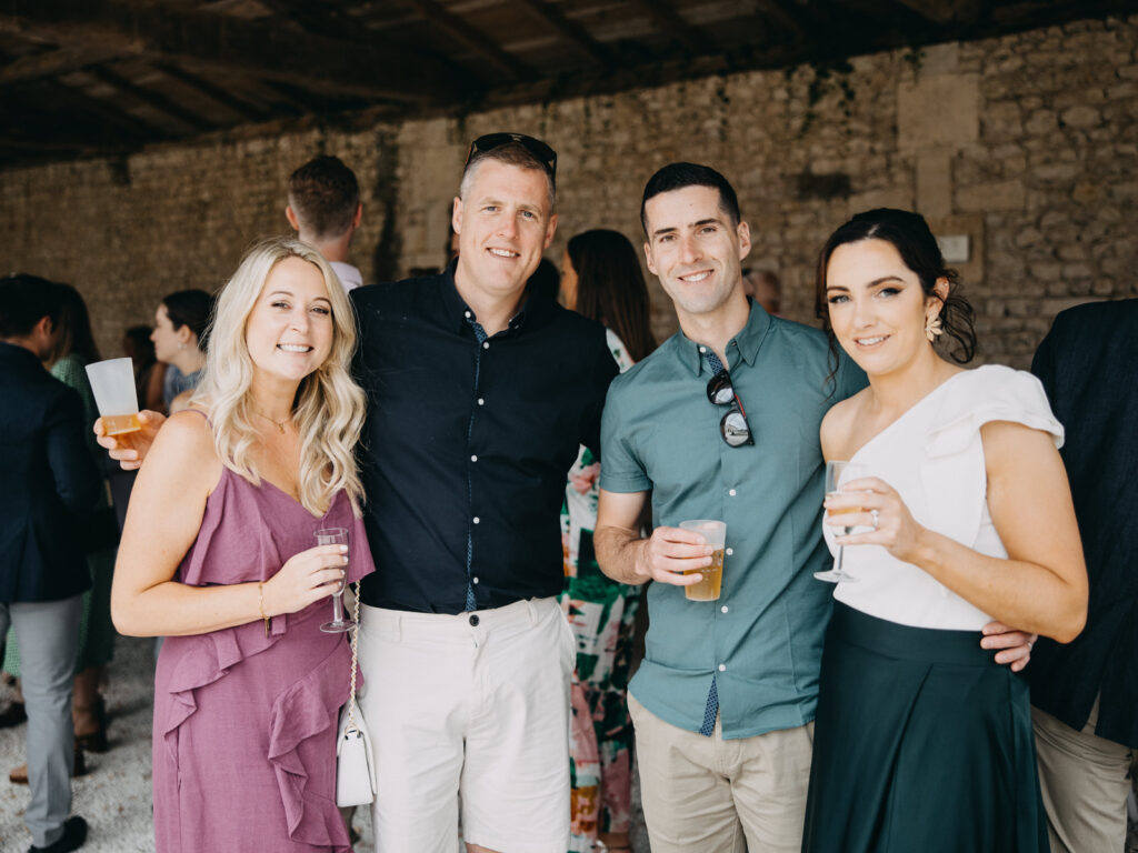 Wedding guests enjoying cocktails during a relaxed Bordeaux City pre-wedding gathering.