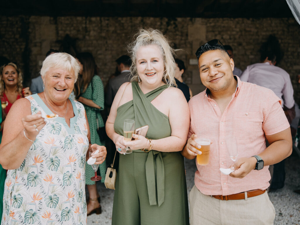 Guests laughing and mingling during welcome drinks.