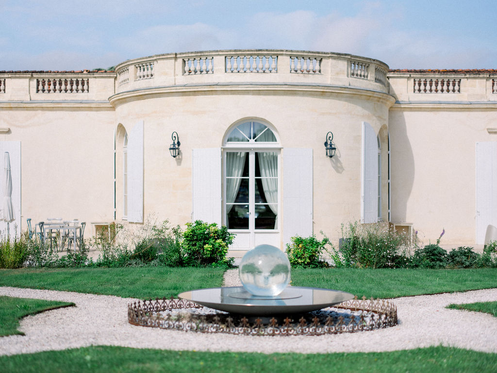 Charming château courtyard with round fountain.