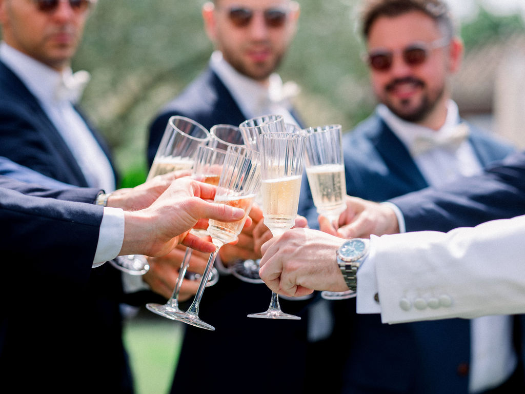 Champagne toast with groomsmen during a Bordeaux City wedding celebration.